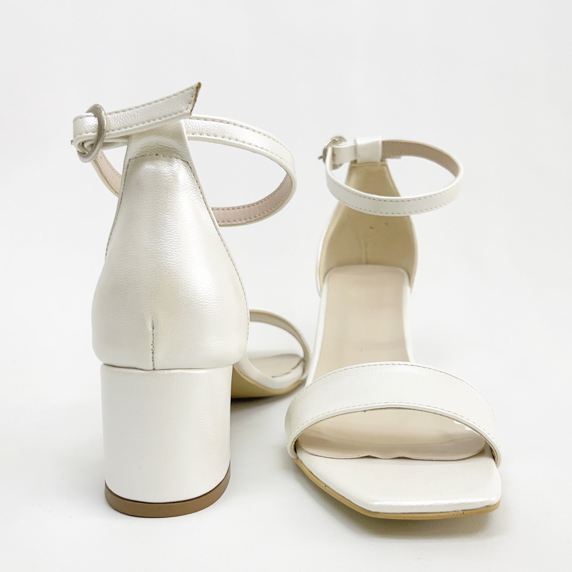 White ivory sandals, Ivory white sandals, Stylish white ivory shoes, Chic white sandals in ivory, Trendy white ivory footwear, Fashionable ivory white sandals, Elegant white ivory heels, Classic ivory white sandals, Comfortable white ivory shoes, White ivory sandals for women.