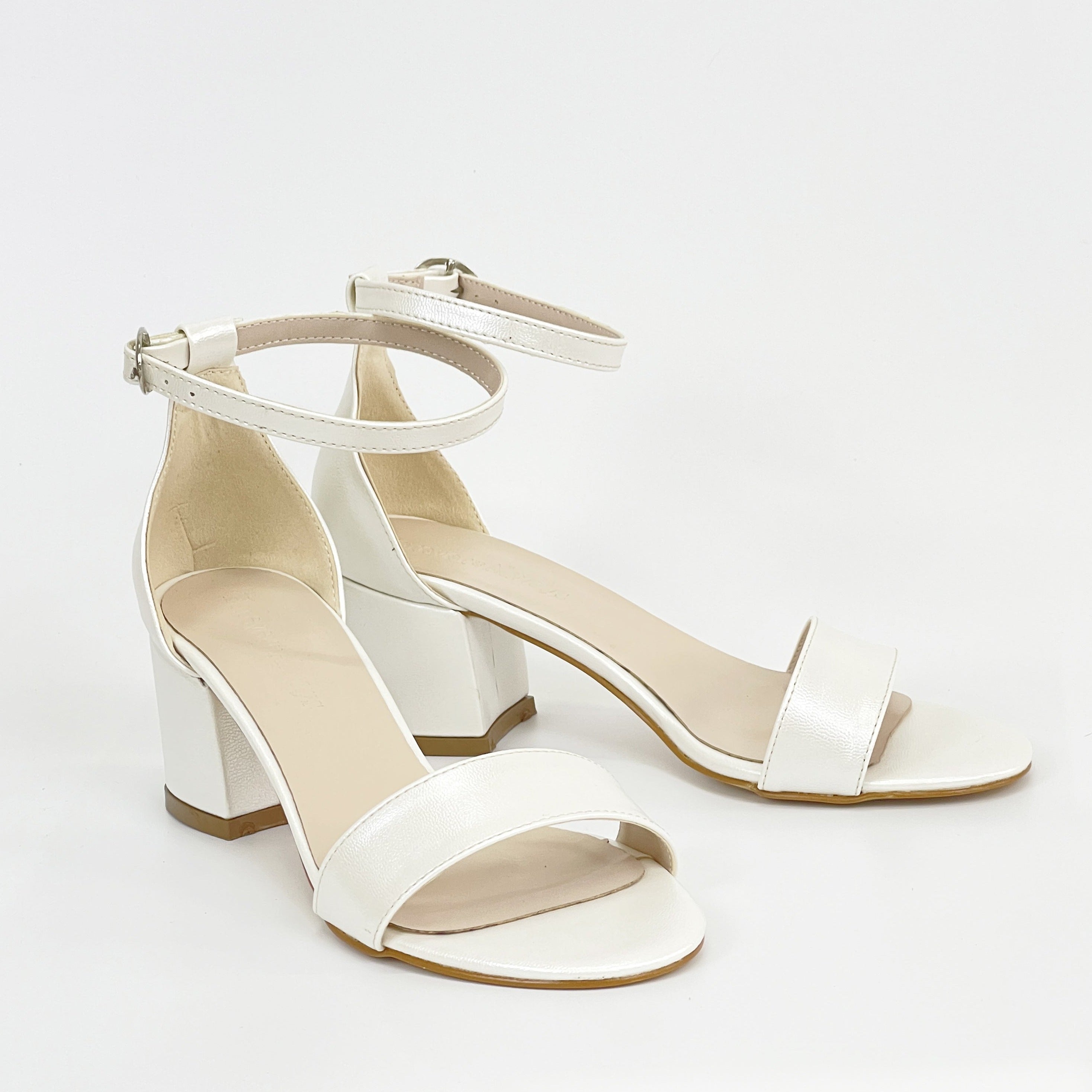 Ivory white sandals, White sandals in ivory, Stylish ivory white shoes, Chic white sandals, Trendy ivory white footwear, Fashionable white sandals, Elegant ivory white heels, Classic white sandals, Comfortable ivory white shoes, Ivory white sandals for women.