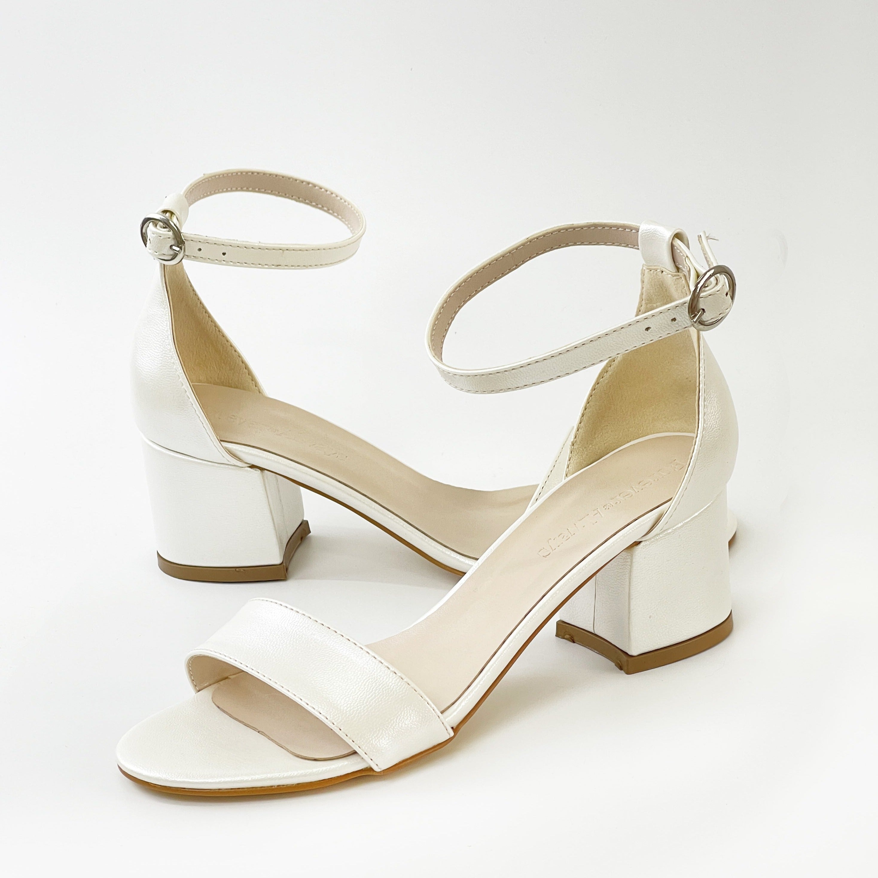 Ivory white sandals, White sandals in ivory, Stylish ivory white shoes, Chic white sandals, Trendy ivory white footwear, Fashionable white sandals, Elegant ivory white heels, Classic white sandals, Comfortable ivory white shoes, Ivory white sandals for women.